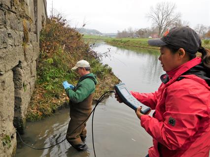Kelly and Li Taking a Water Quality Sample of a Spring Outlet in Galena, Illinois